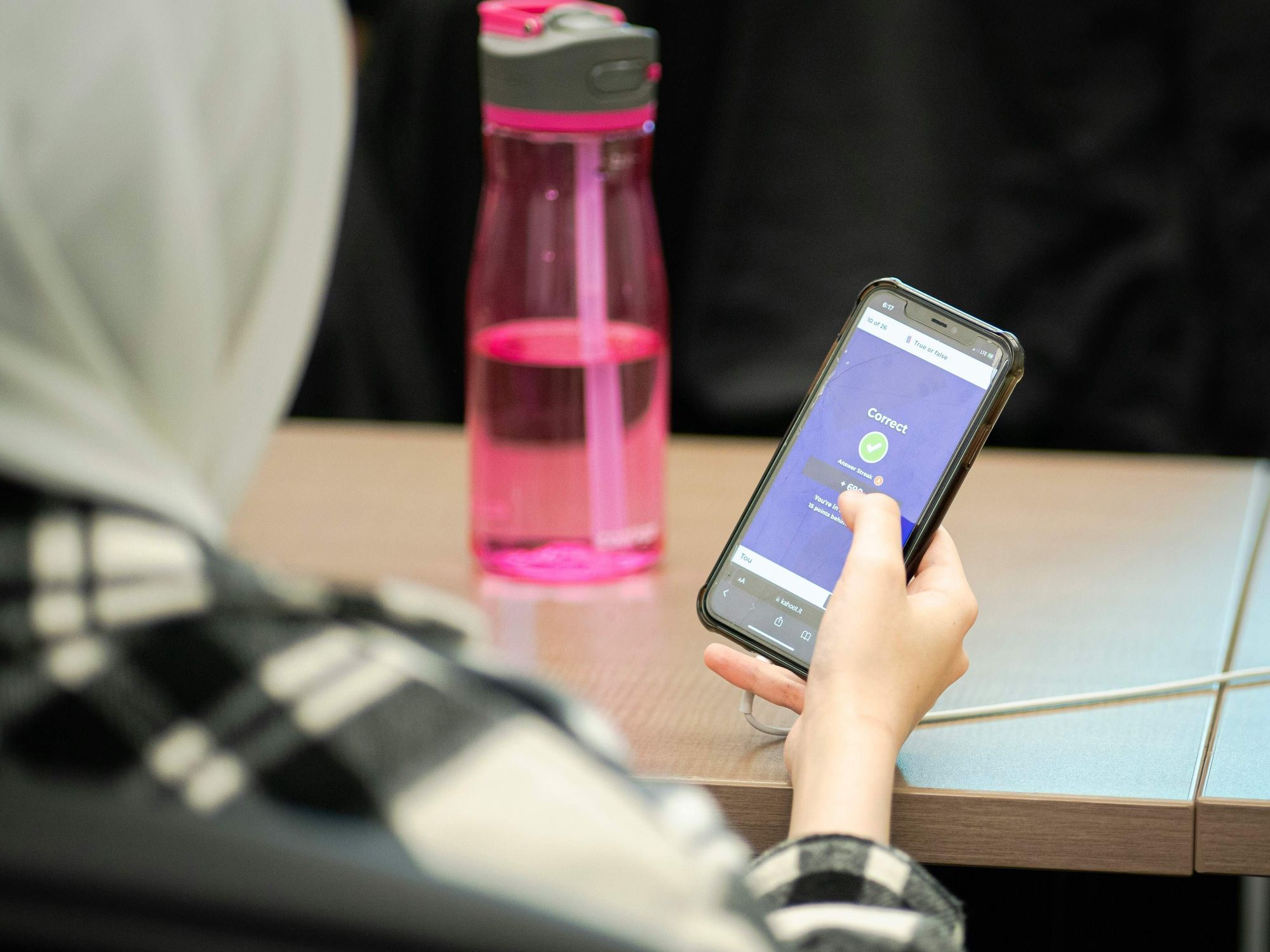 High schooler with cell phone