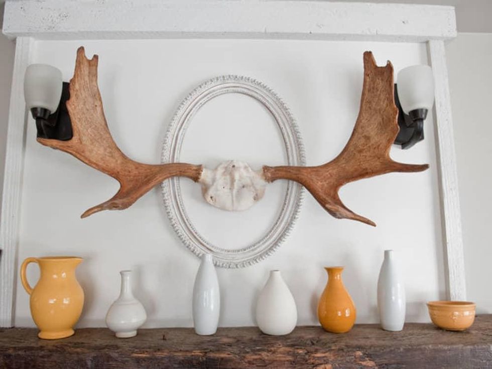Houzz mantel with antlers and vases