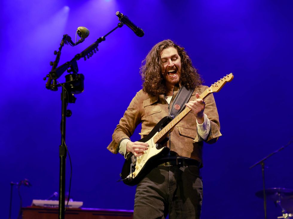 Hozier with guitar onstage