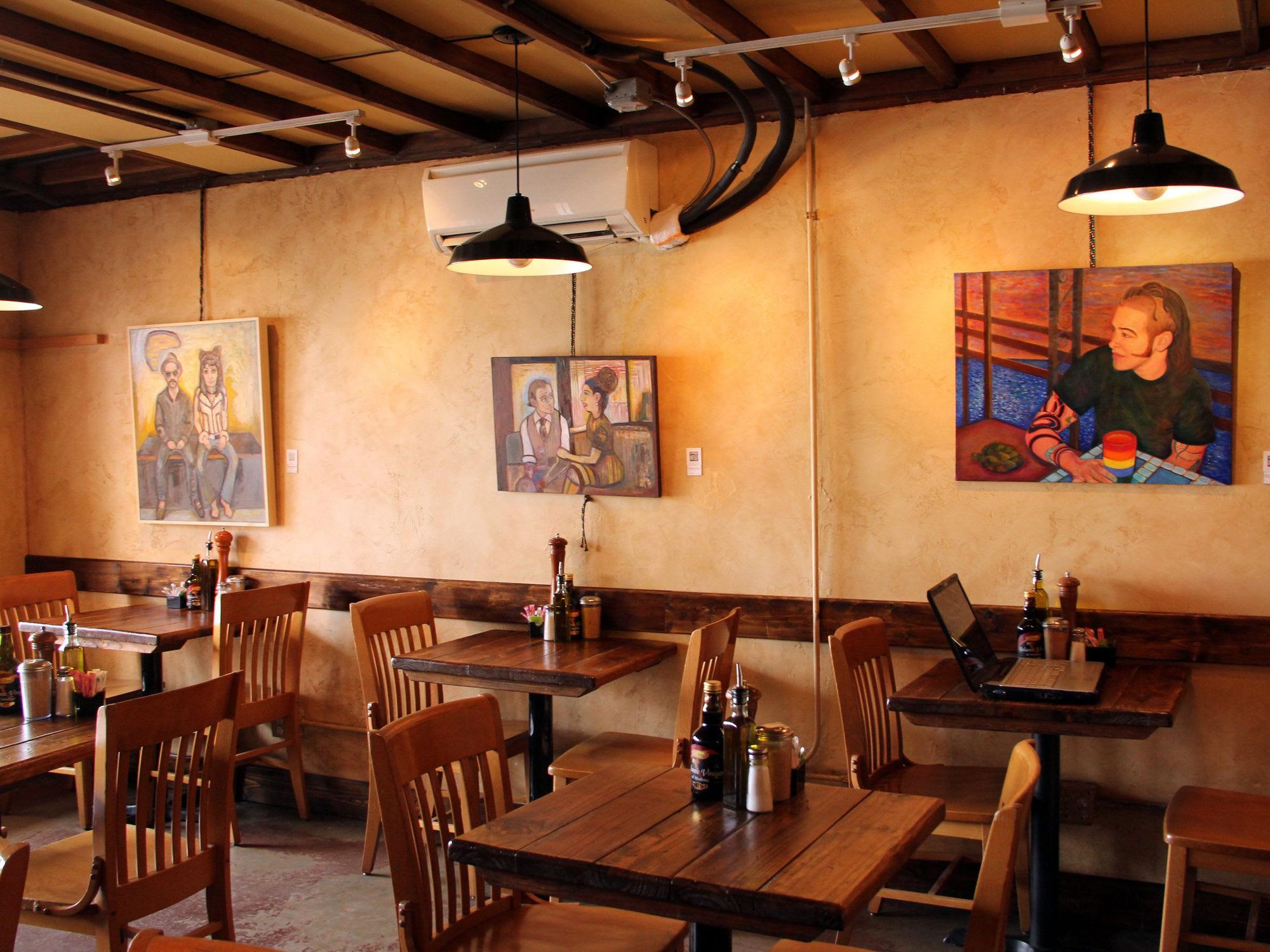 interior of Blue Dahlia Bistro with paintings
