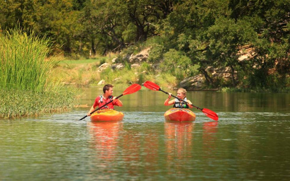 Kids kayaking on Onion Creek