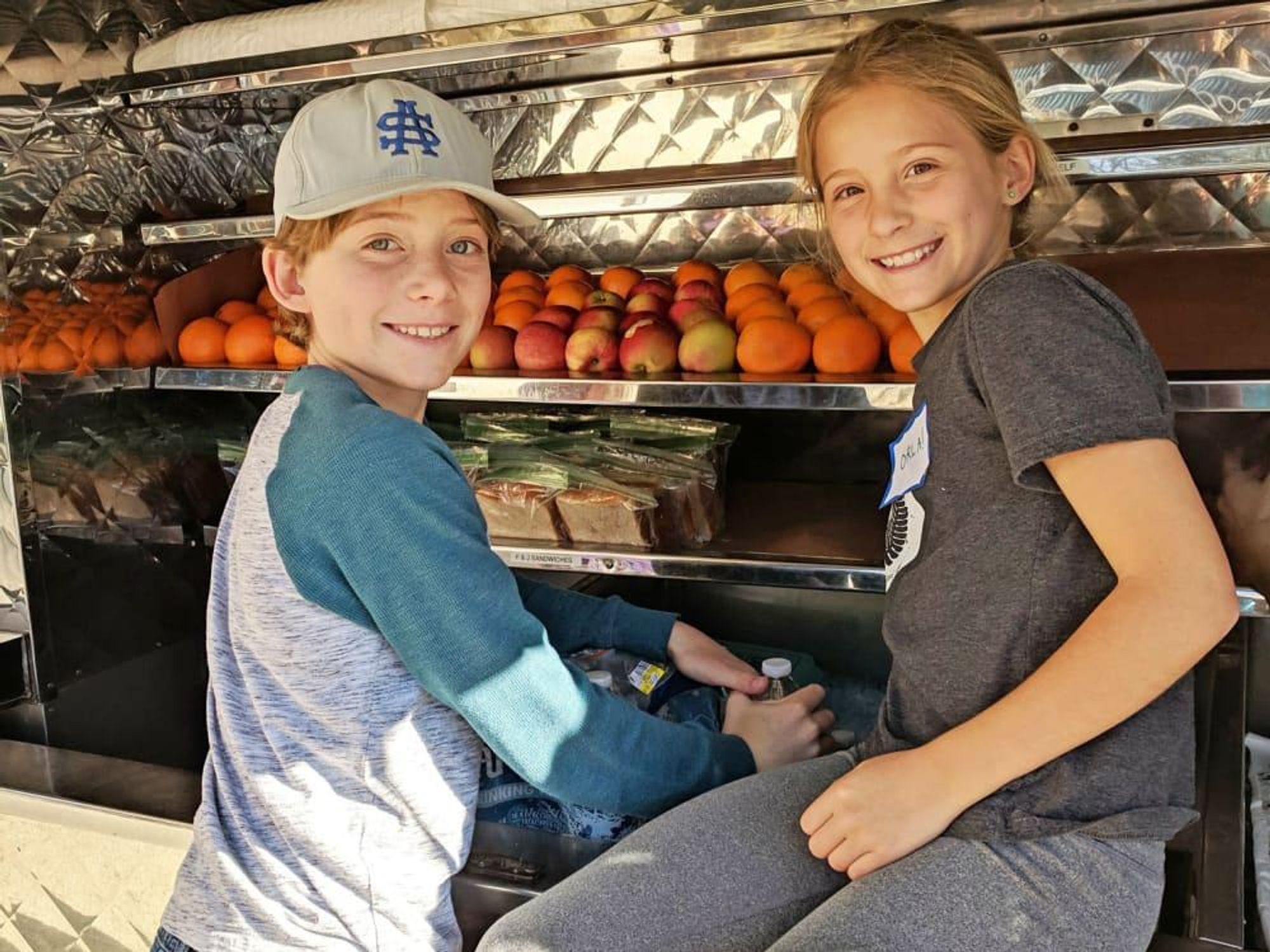 Kids volunteering generation serve mobile loaves and fishes