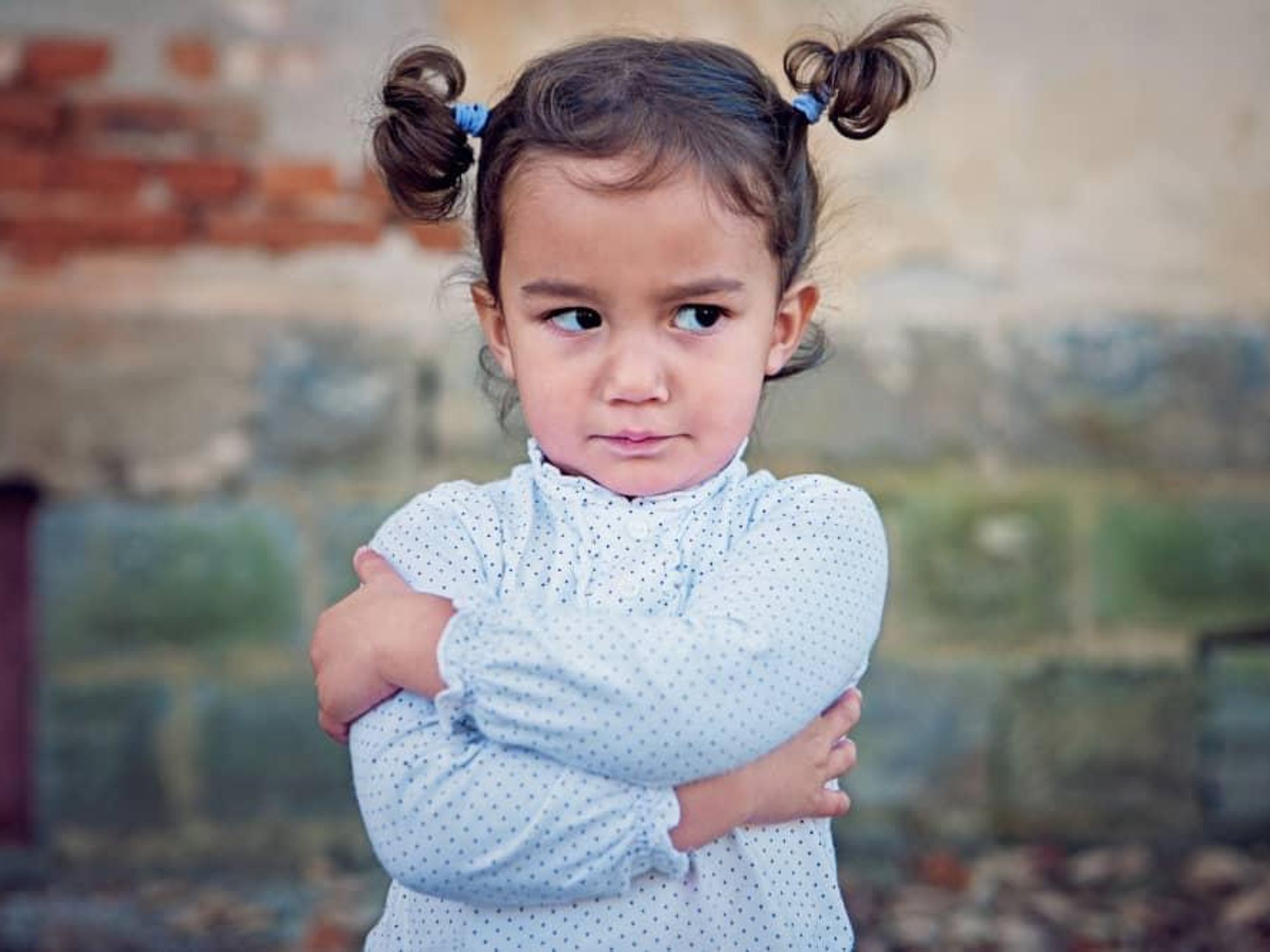 Little girl crossed arms