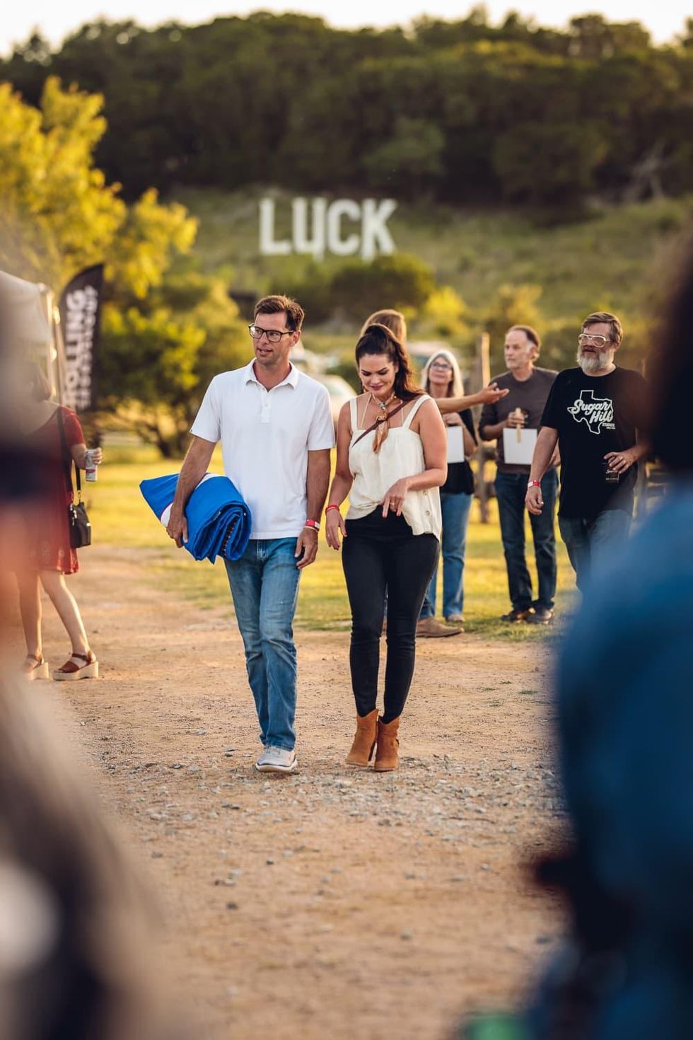 Luck Cinema sign and couple