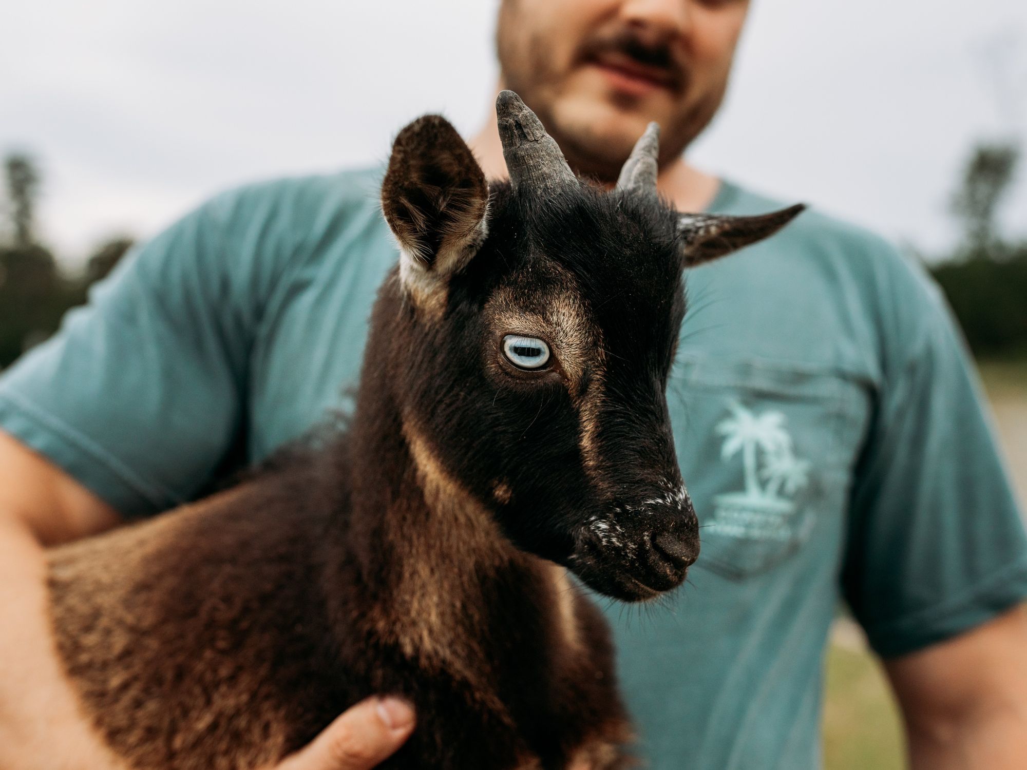 Man holding goat