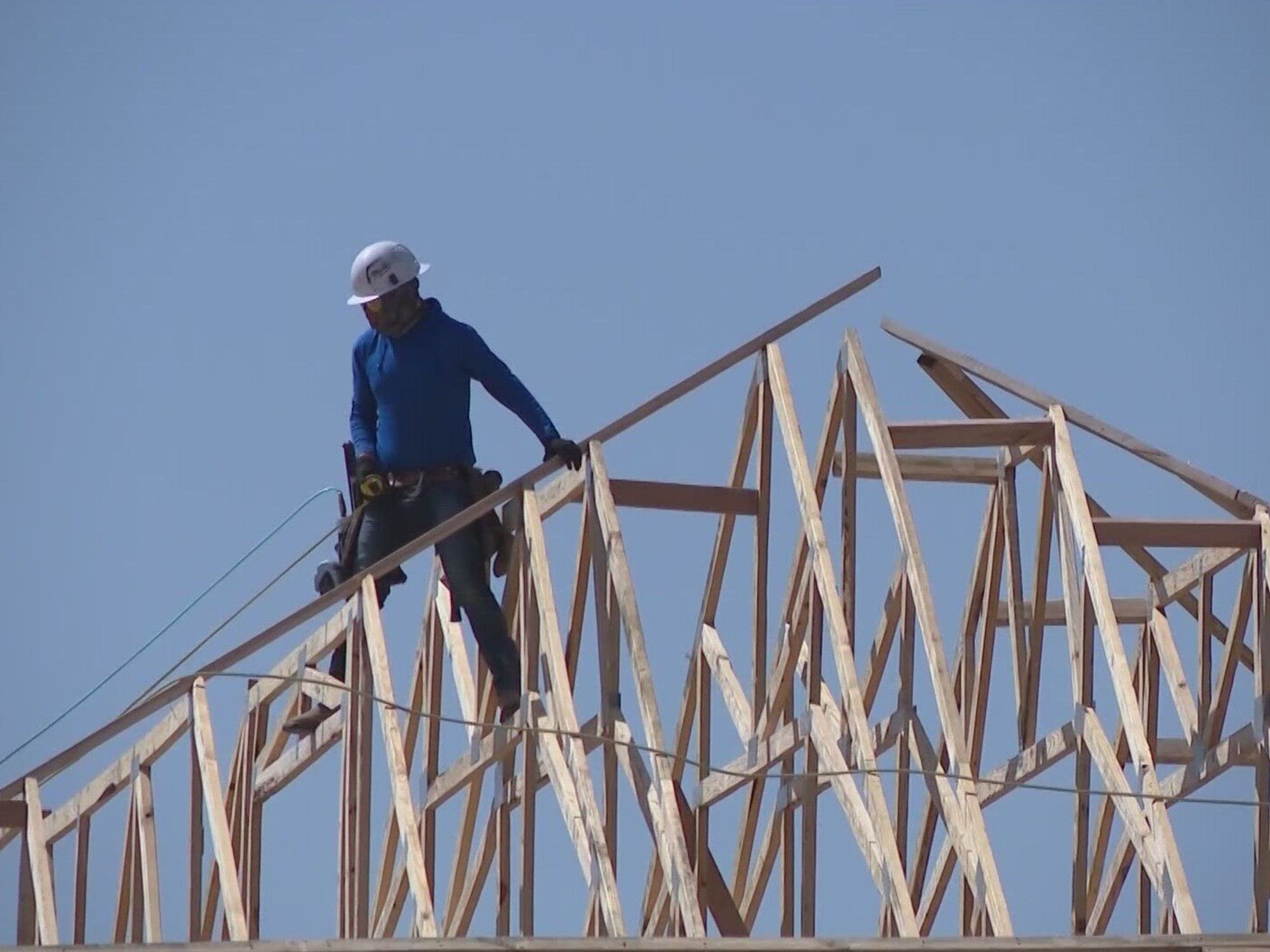 Man on house framing