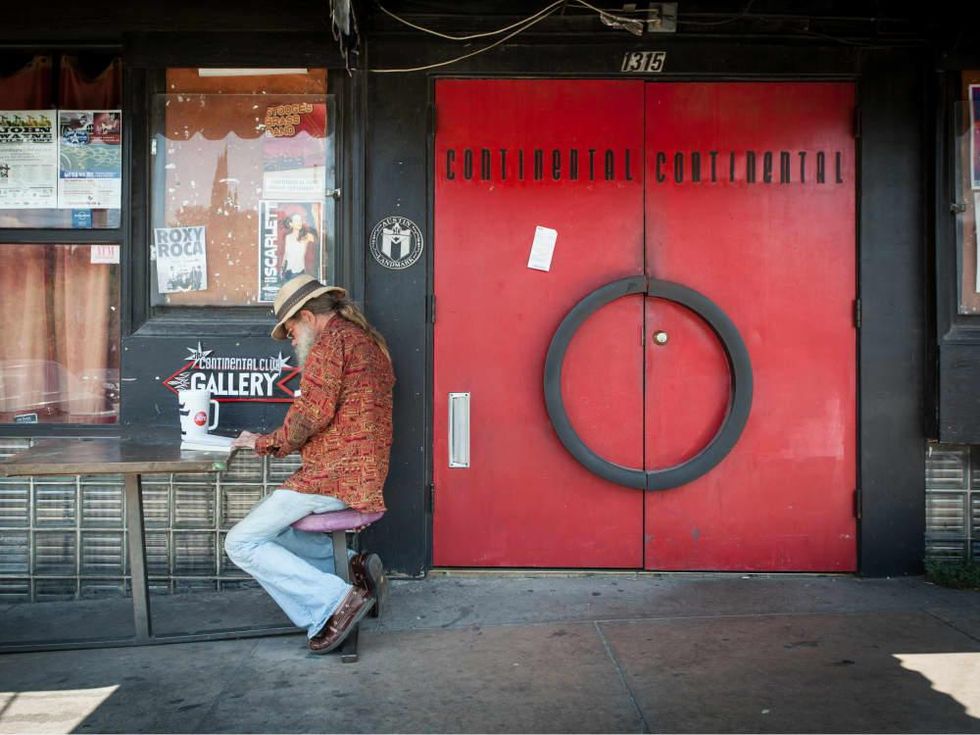 man reading continental club