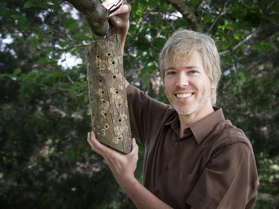 Marshall Hinsley with a bee abode that he built