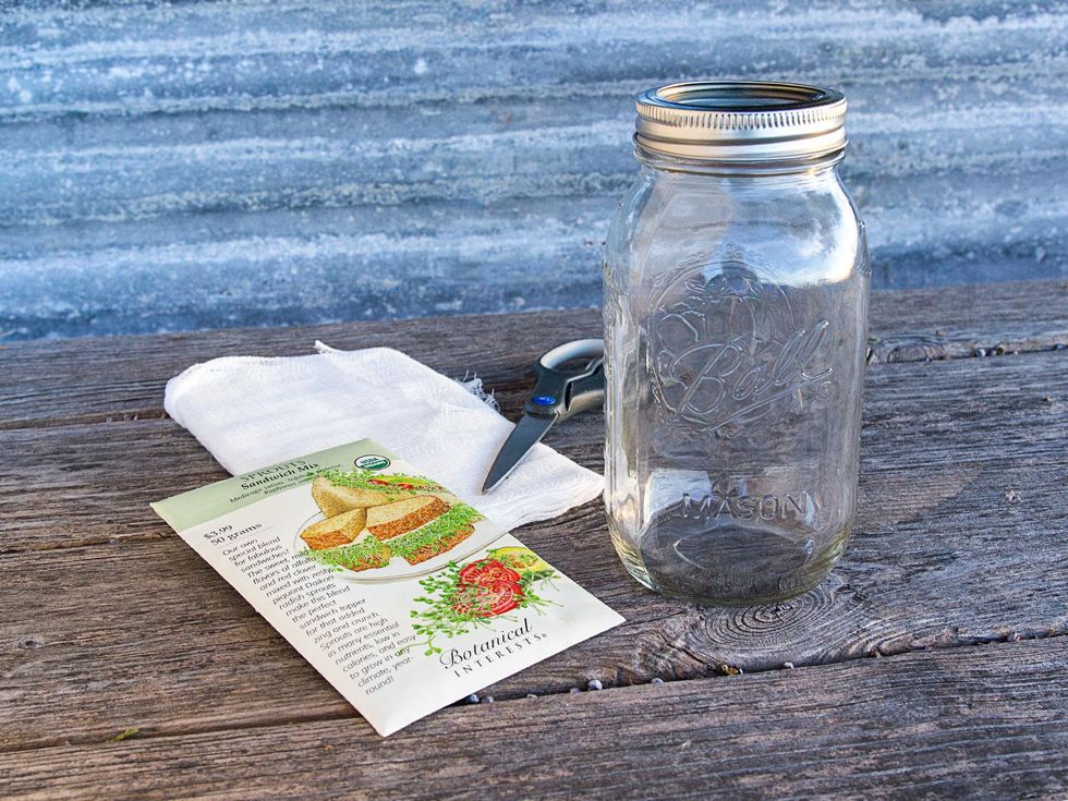Mason jar, scissors and cheesecloth