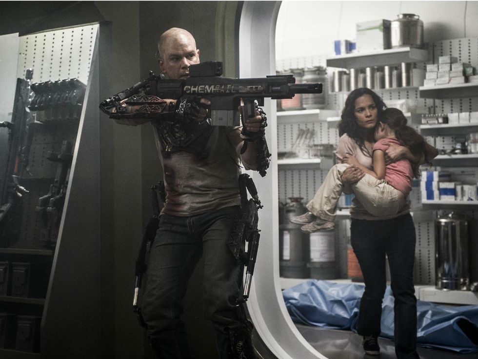 Matt Damon and Alice Braga in Elysium