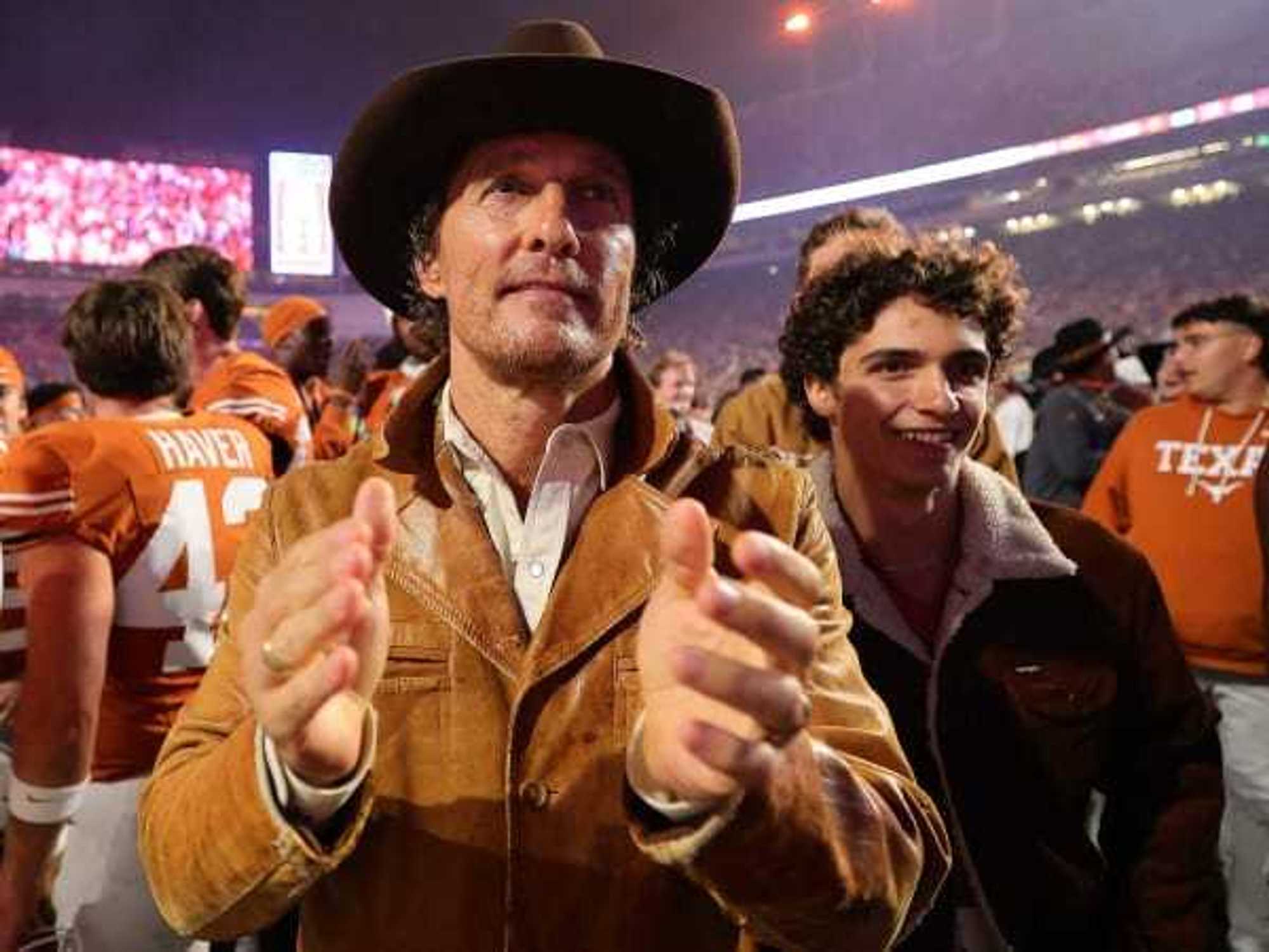 Matthew McConaughey and his son, Levi, at a UT football game