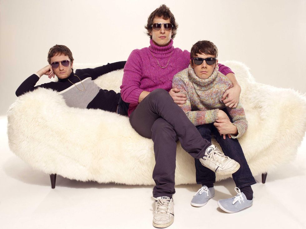 members of the Lonely Island sitting on a couche