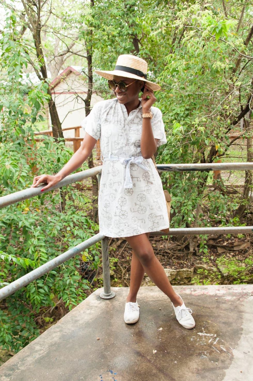 Model wears white dress and white tennis shoes in austin, texas