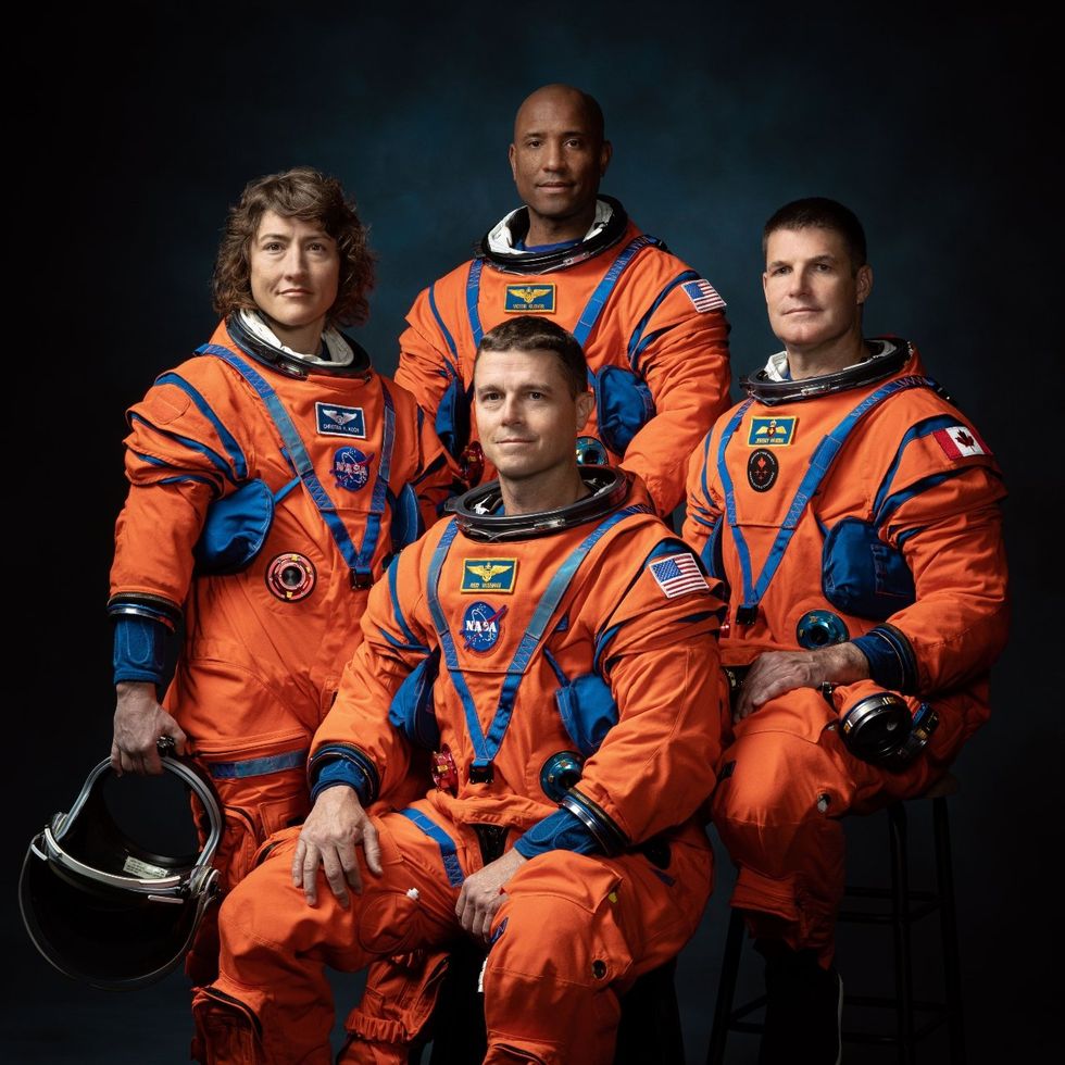 NASA Artemis II mission astronauts Christina Hammock Koch, Reid Wiseman (seated), Victor Glover, and Canadian Space Agency astronaut Jeremy Hansen.