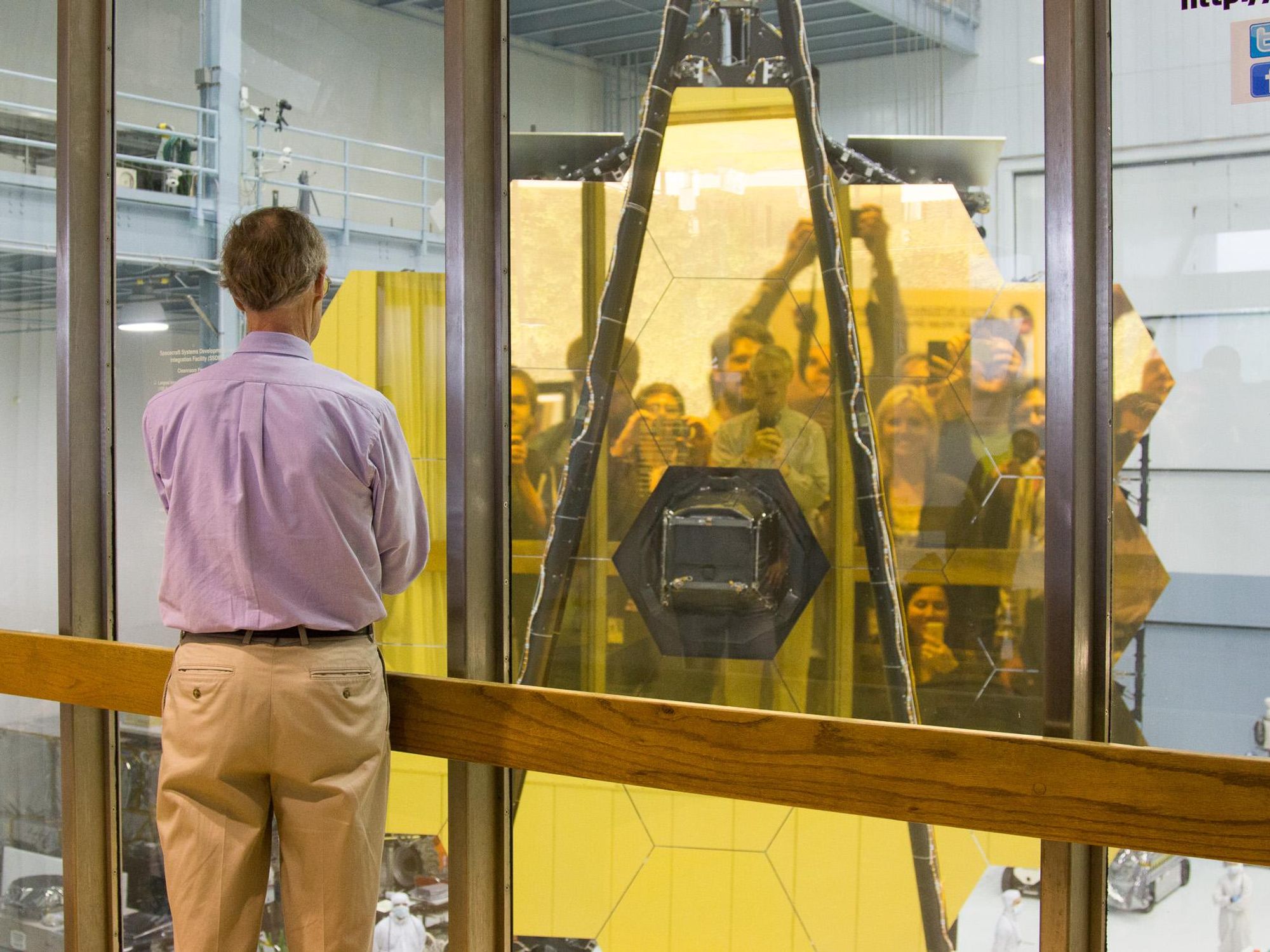 NASA scientist looking at James Webb Telescope