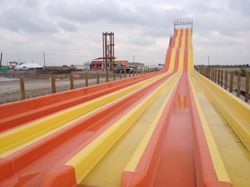orange and yellow slides at Pflugerville water park Hawaiian Falls