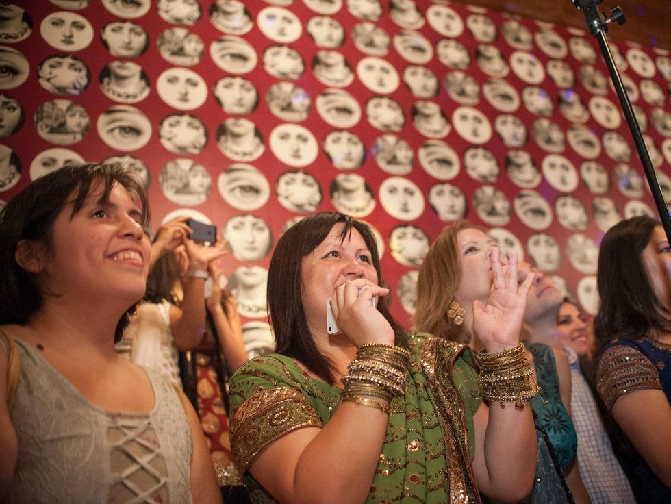 Partygoers enjoy dance performance at Bollywood Ball