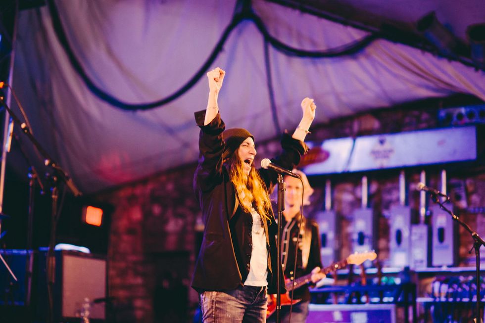 Patti Smith with her hands up