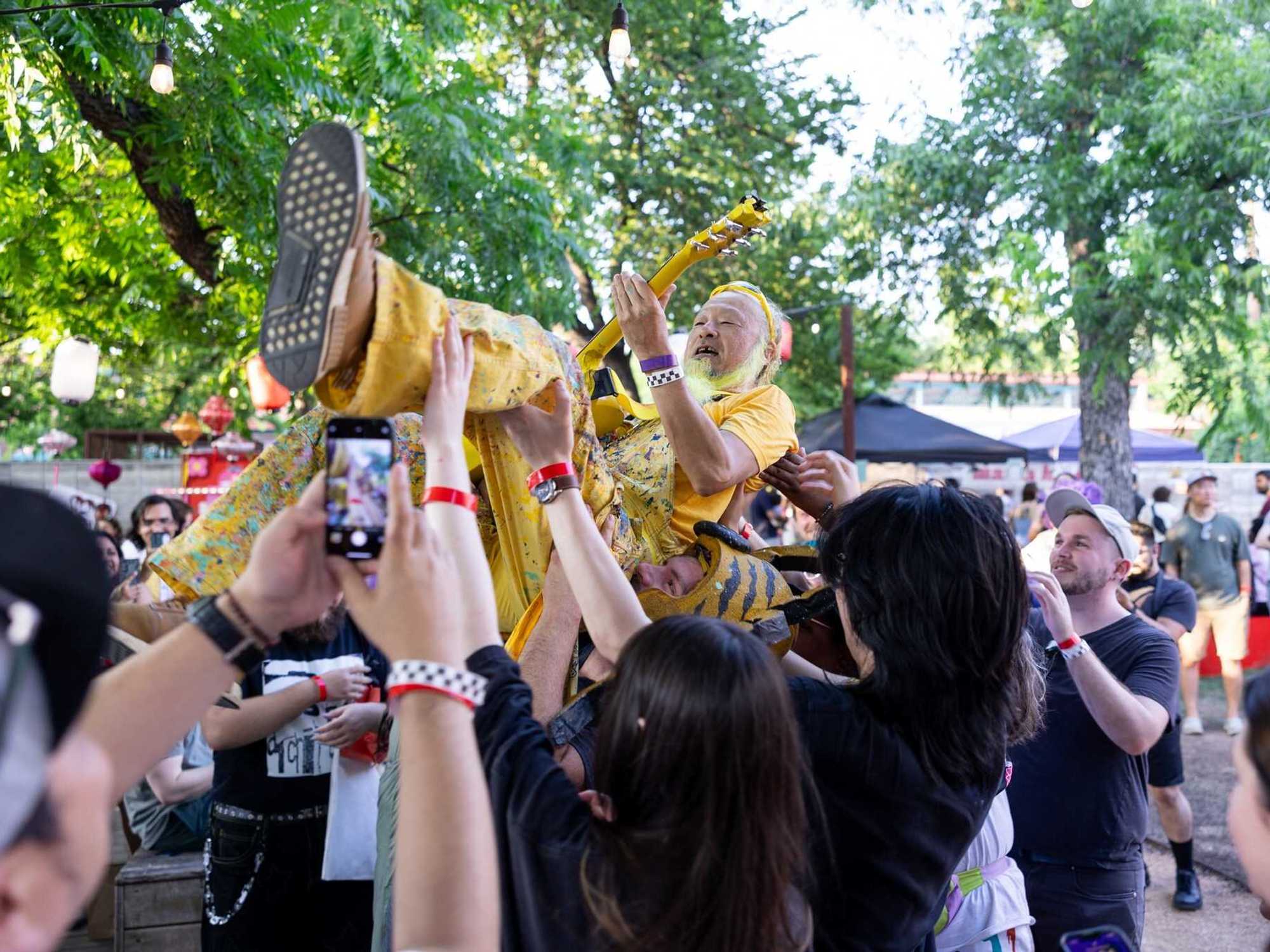 Peelander-Z crowdsurfing at NightMarket.fun
