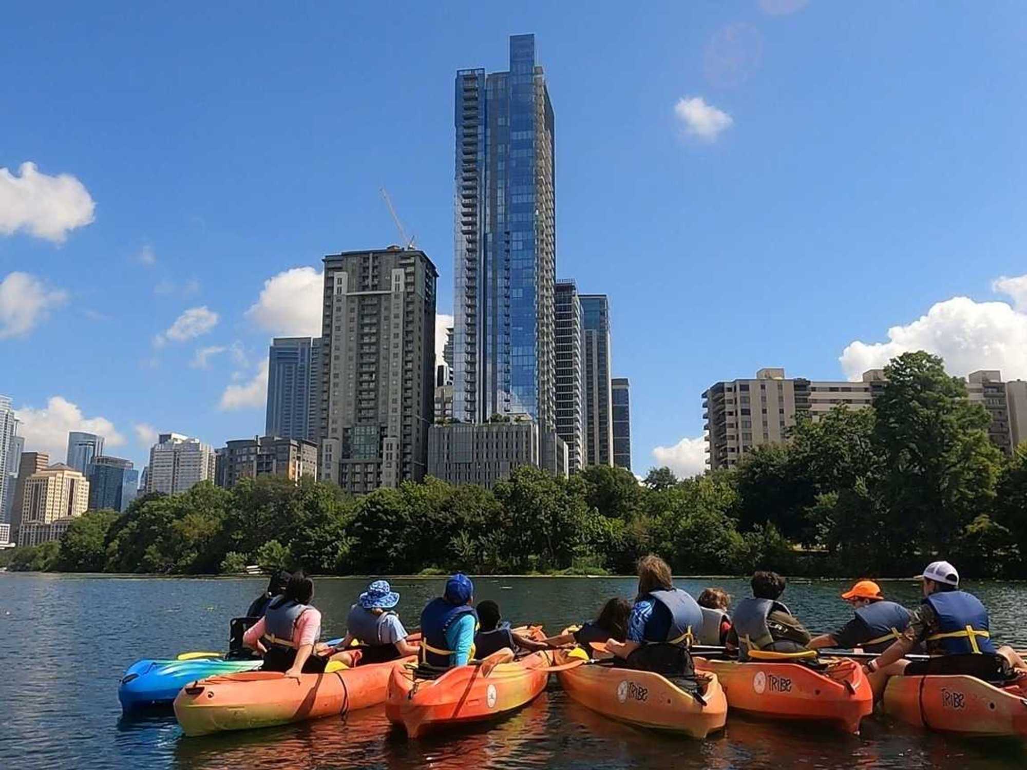 People canoeing in the river in downtown Austin