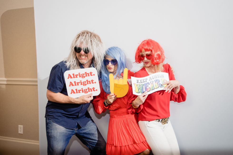 People in wigs at photobooth