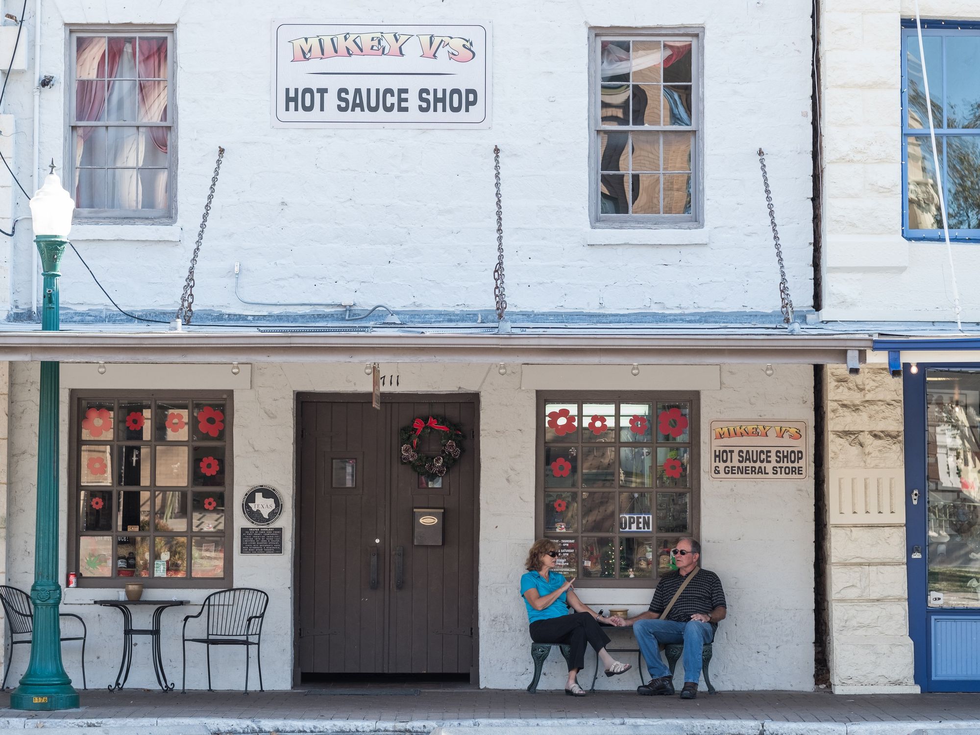 People sitting outside of Georgetown storefront