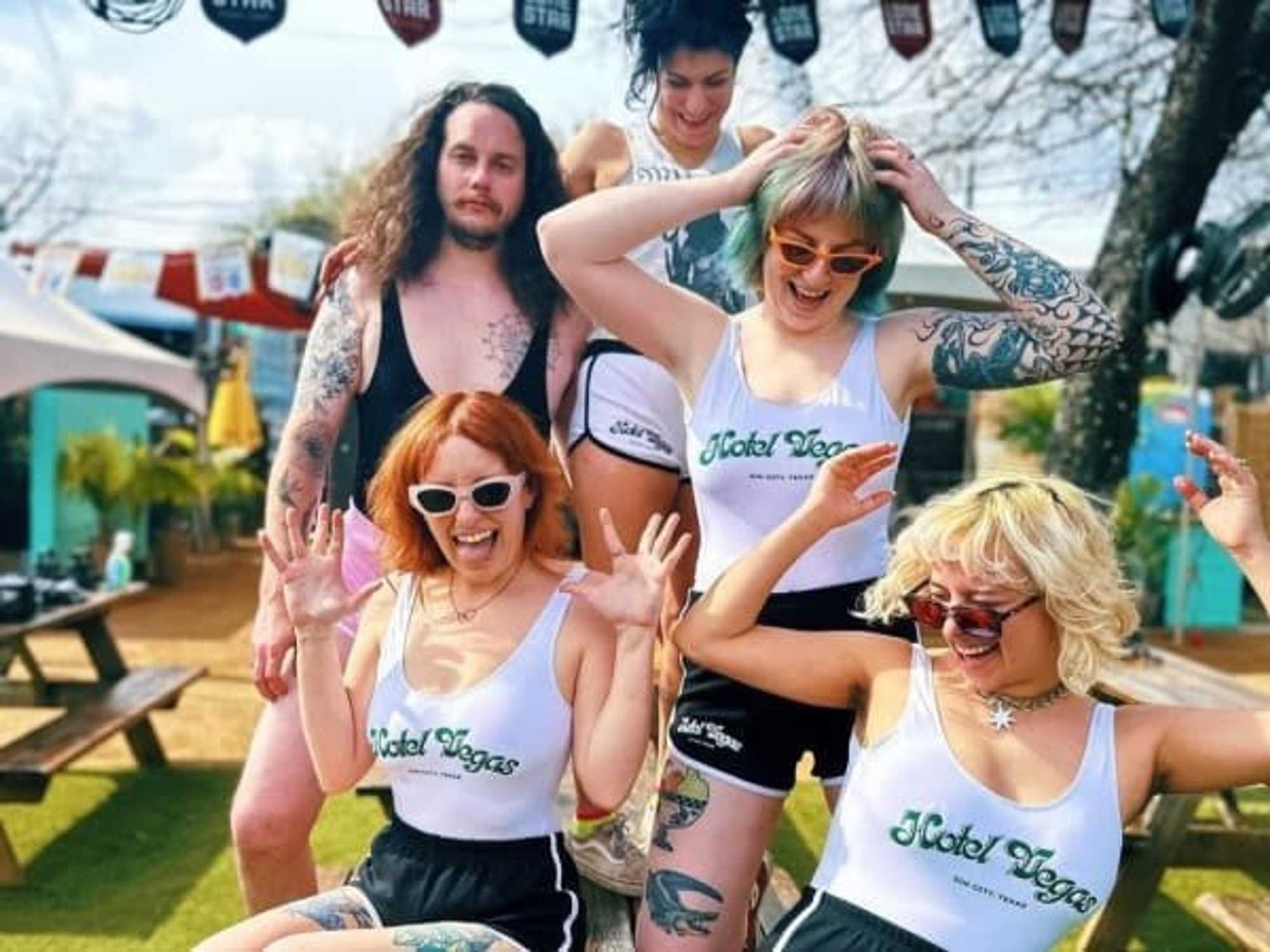 People wearing Hotel Vegas merch