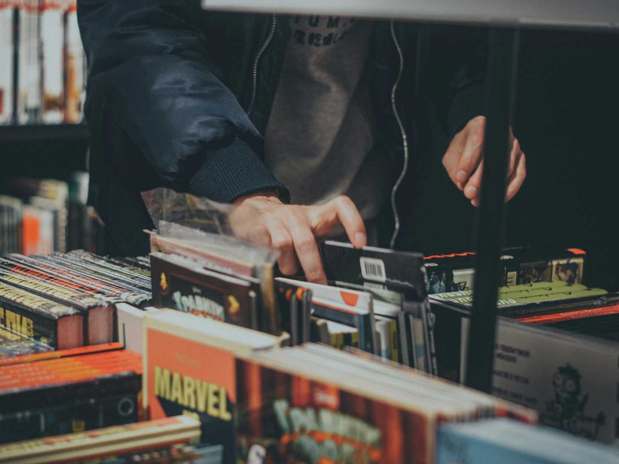 Person browsing comic books