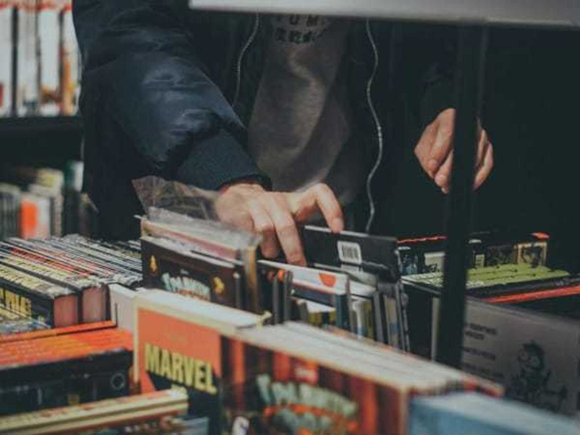 Person browsing comic books