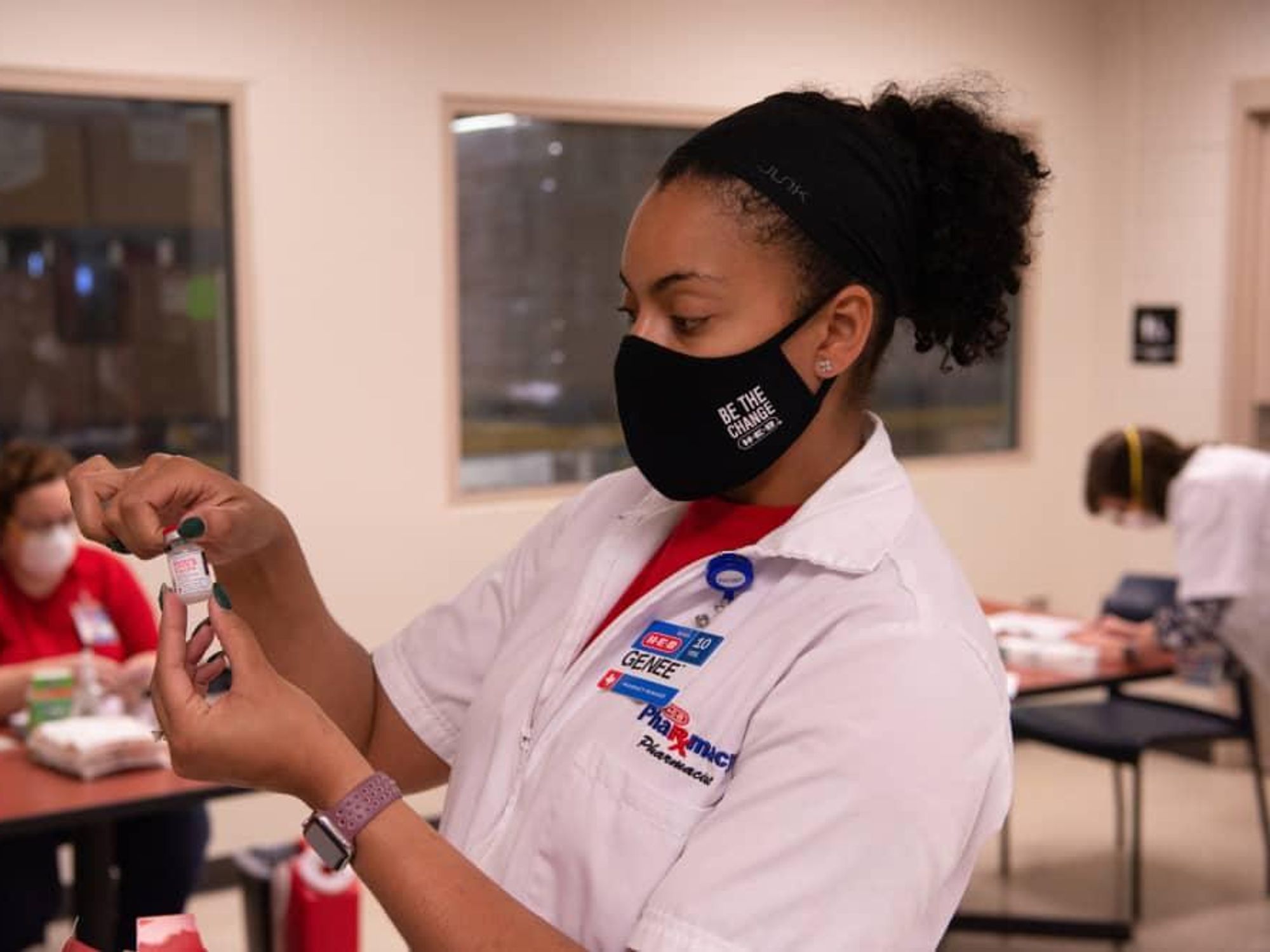 Pharmacy woman holding vaccine covid-19 coronavirus