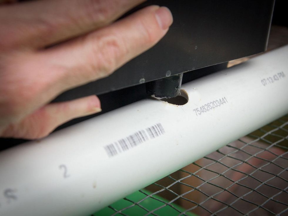 Photo of Dutch bucket fitting into PVC pipe