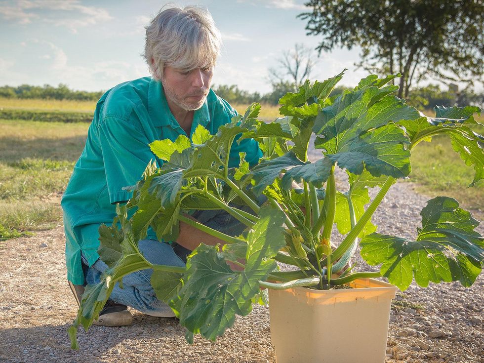 Photo of Marshall Hinsley with Dutch bucket