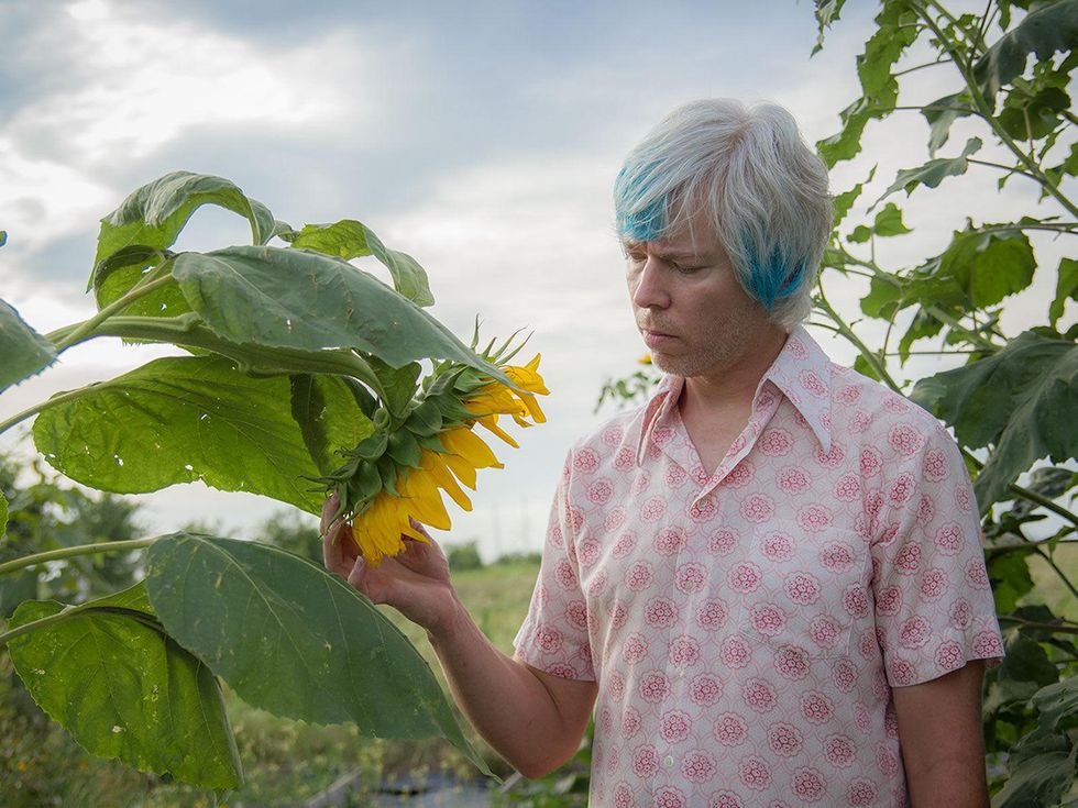 Photo of Marshall Hinsley with sunflower
