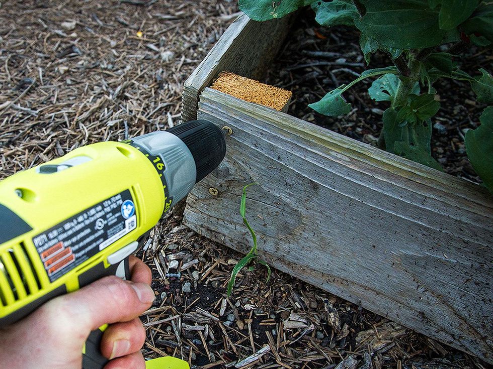 Photo of raised garden bed being repaired