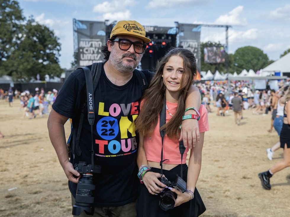 Photographers Daniel and Ryder Cavazos taking photos at Austin City Limits Festival.