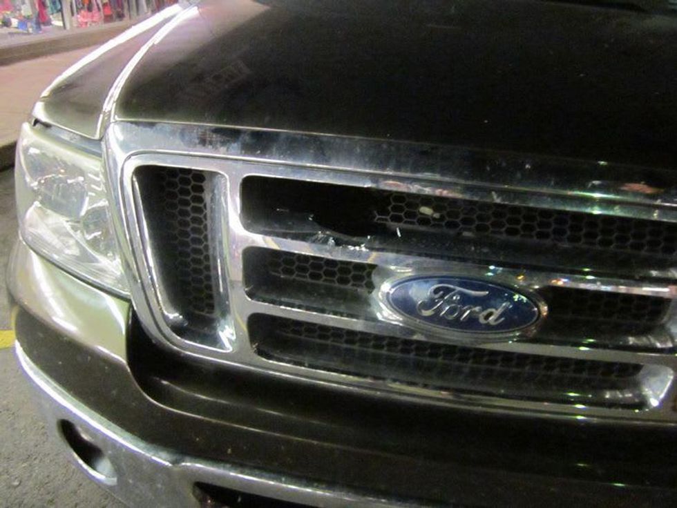 pickup truck hit by rock in grill near I-35 austin