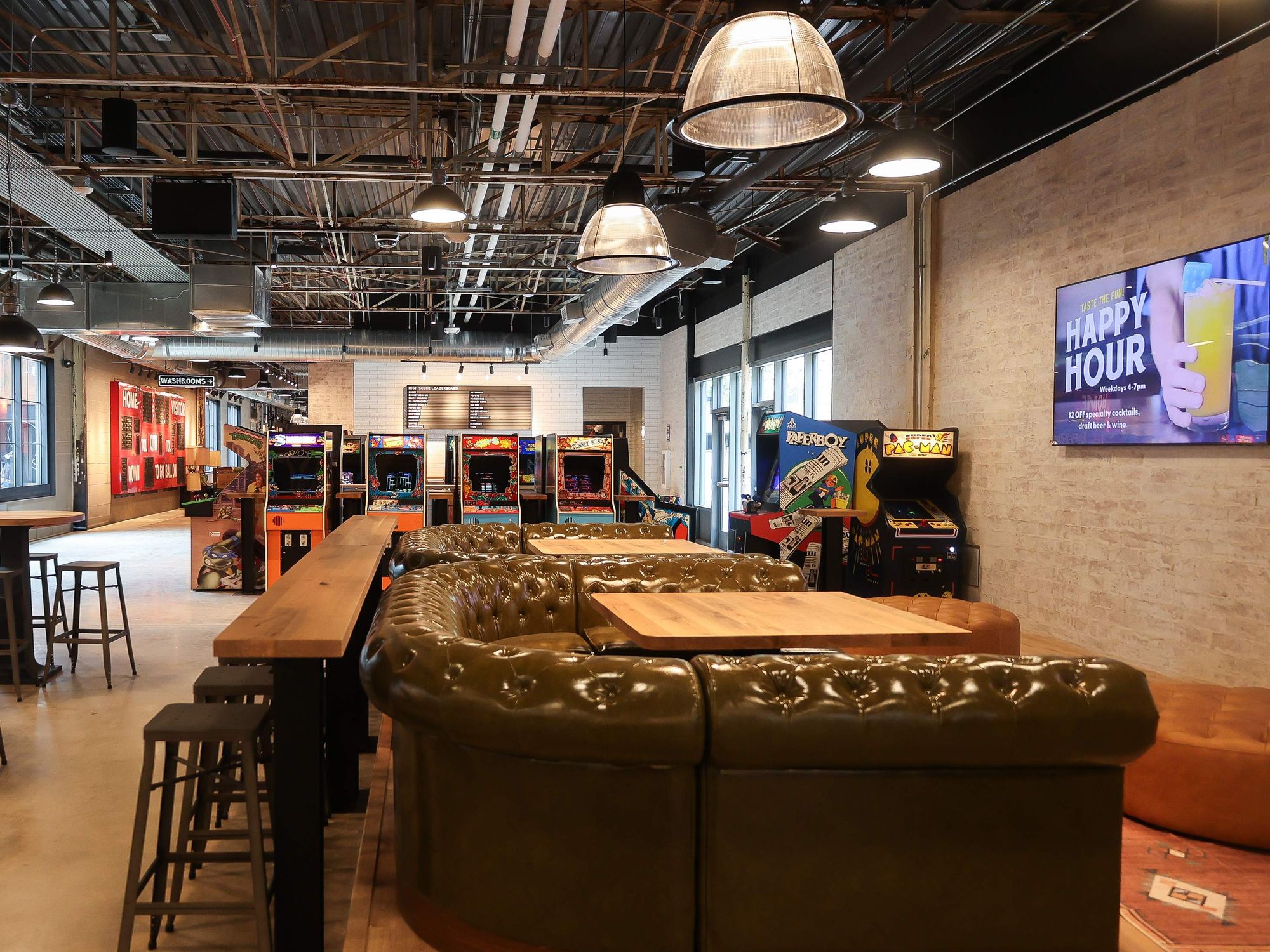 Pins Mechanical Co. interior showing arcade games and seating