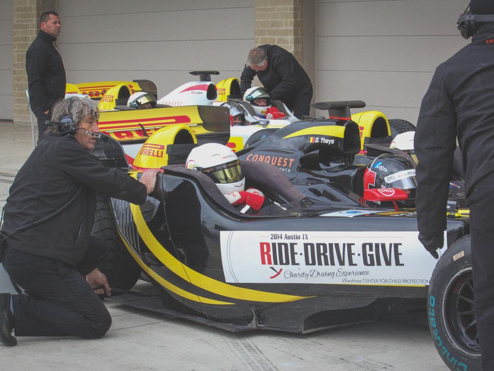 pit crew for Formula 1 ride along in pit lane for Ride Drive Give benefit