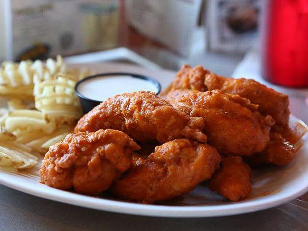 Pluckers Wing Bar chicken wings and french fries