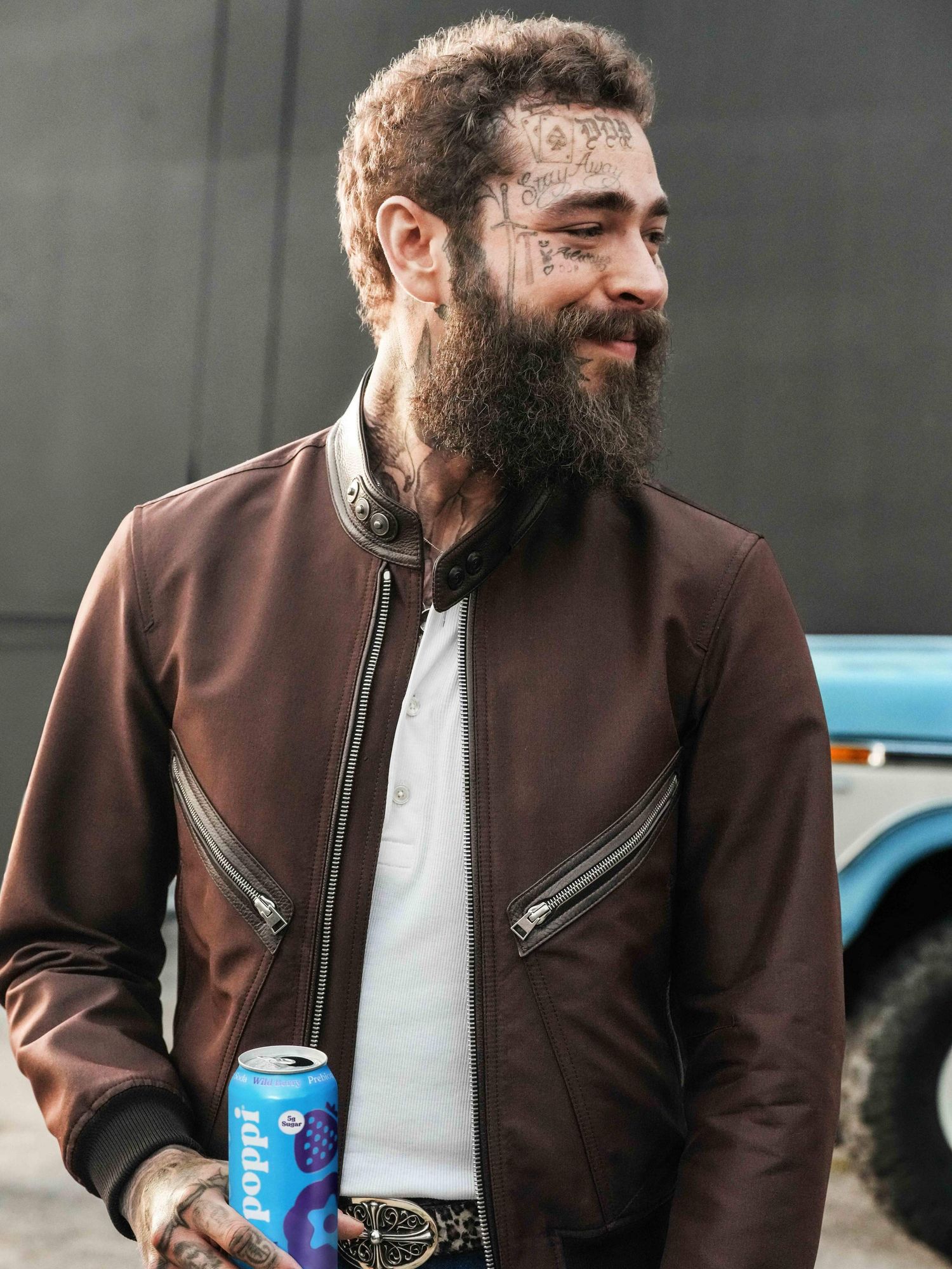 Post Malone holding poppi can