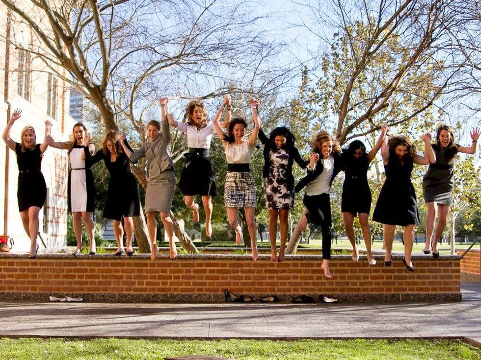 Rice University Jones Graduate School of Business girls jumping off stairs