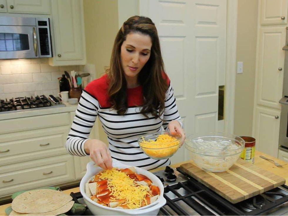 Roni Proter preparing enchiladas