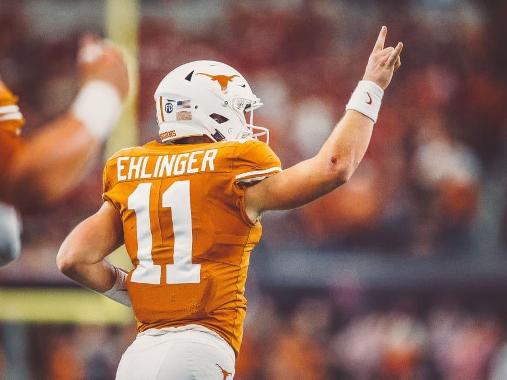 Sam Ehlinger UT Longhorns football player hook em hand
