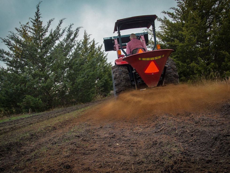 Soil amendments being applied to farmland.