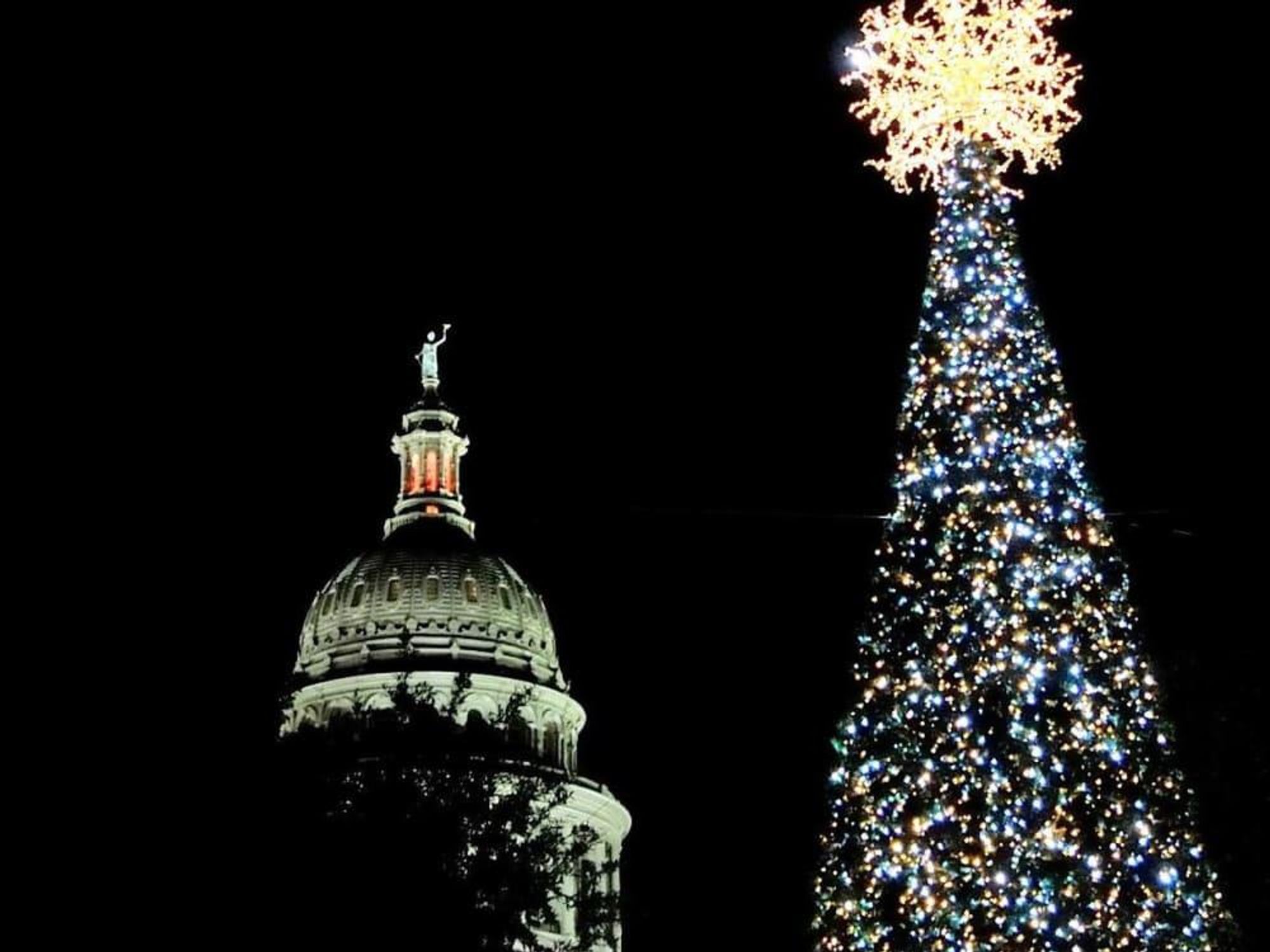 State Capitol and holiday Christmas tree lit up at night
