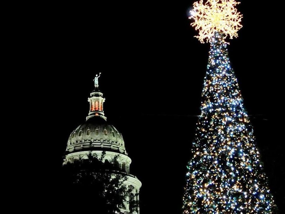 State Capitol and holiday Christmas tree lit up at night