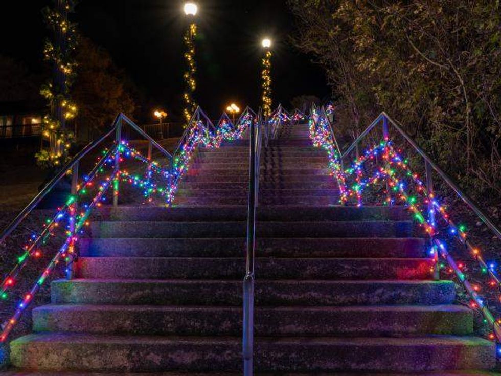 Steps adorned with colorful Christmas lights.