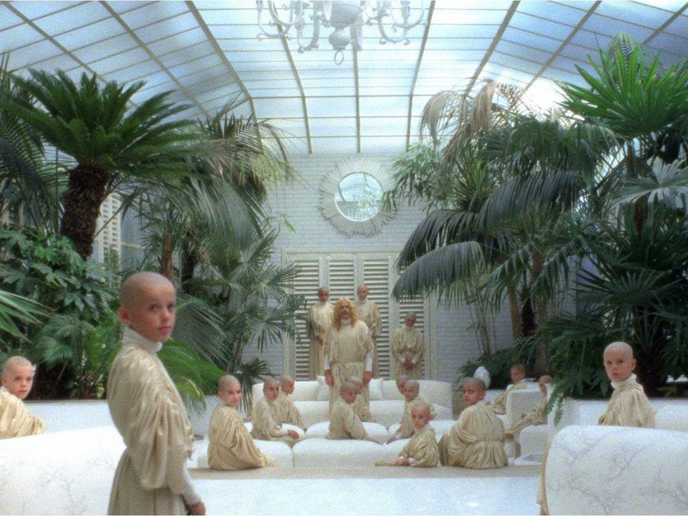 still from Drathouse Films The Visitor with children and Franco Nero as space Jesus