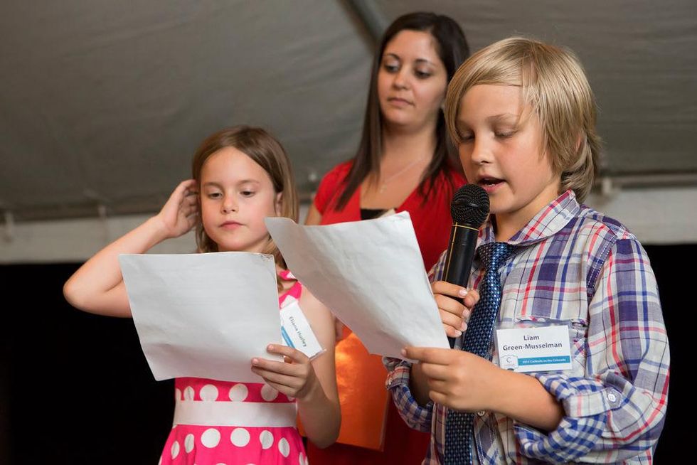 Students from UT Elementary reading thank you letters at the Colorado River Alliance 12th Annual Cocktails on the Colorado Gala