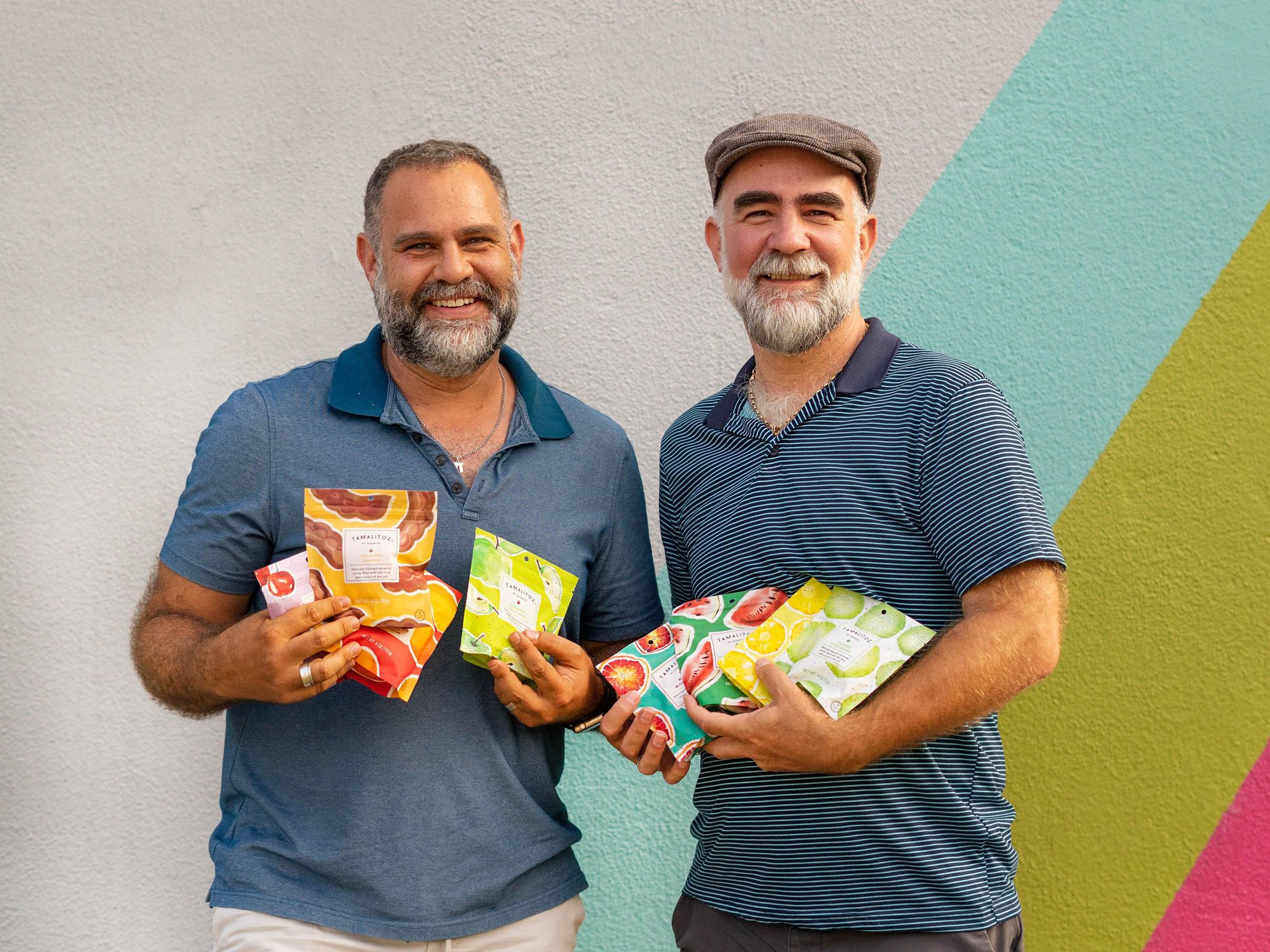 Tamalitoz owners pose with Austin-based candy. Cropped.